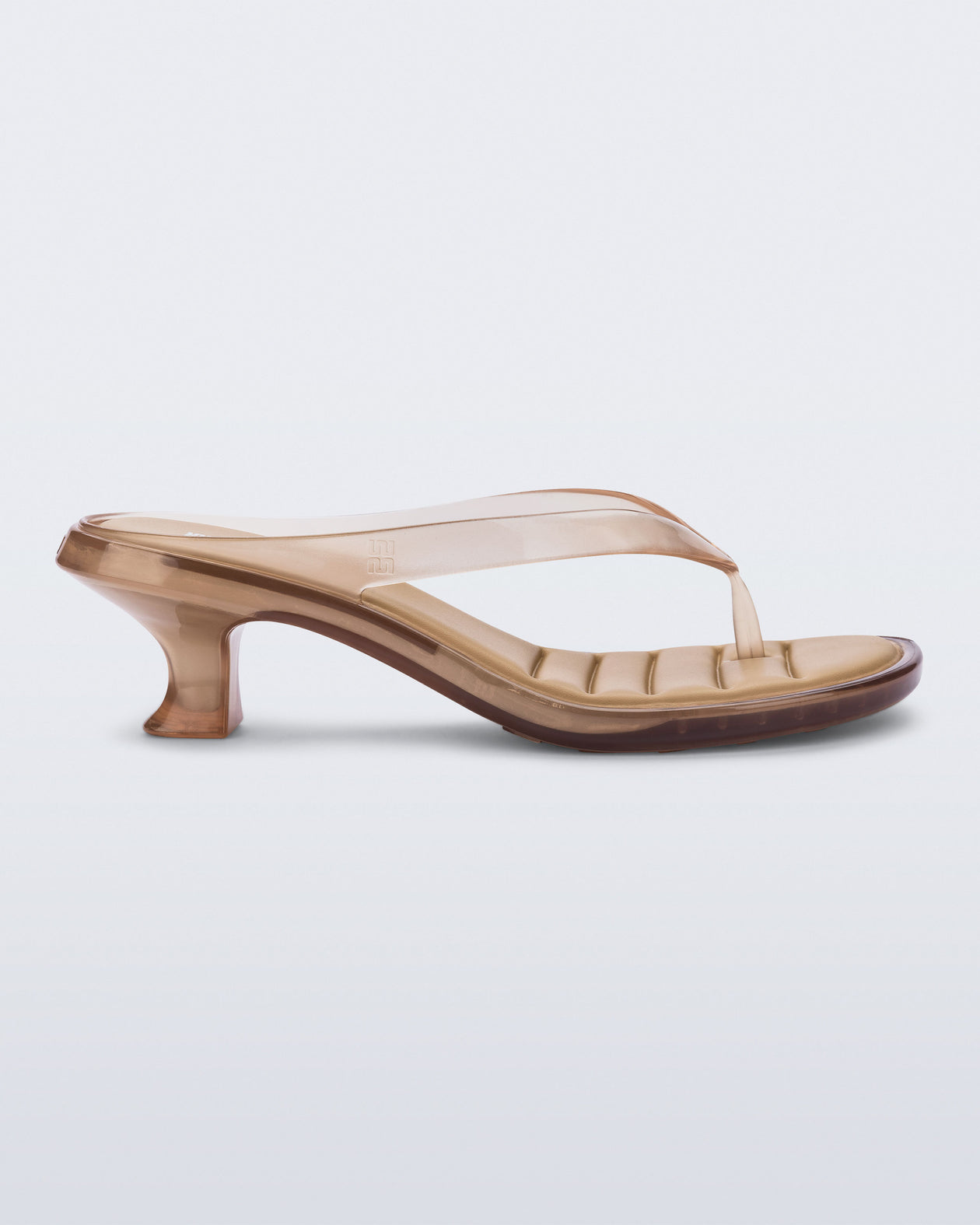 Side view of a clear beige Flip Flop Kitten Heels