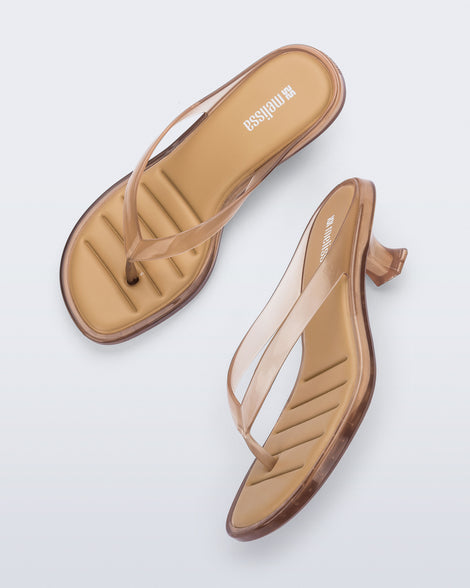 Top and side view of a pair of clear beige Flip Flop Kitten Heels