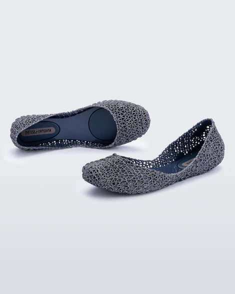 Top and side angled view of a pair of blue/glitter Campana flats