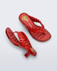 Top and side view of a pair of red Flip Flop Kitten Heel + GANNI sandals with banana print foot bed and faux ruffle strap