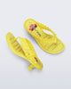 Top and side view of a pair of yellow Flip Flop Kitten Heel + GANNI sandals with cherry print foot bed and faux ruffle strap