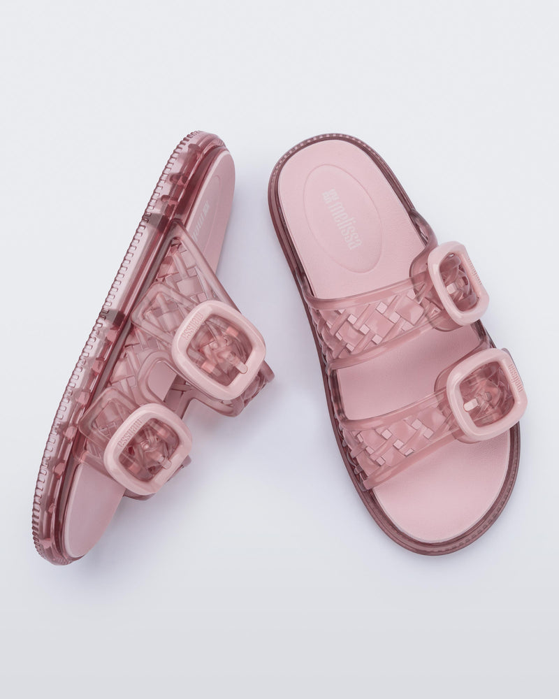 Top and side view of a transparent pink Possession Slip sandals with two top straps