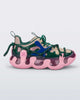 Side view of a Melissa X Icon sneaker with pink sole and green and blue accents