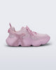 Side view of a pink Melissa X Rush sneaker
