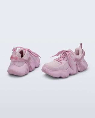 Back and side view of a pair of pink Melissa X Rush sneakers