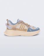 Side view of a Melissa X sneaker with beige and blue design on a light gray background