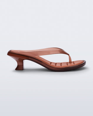 Side view of a brown Flip Flop Kitten Heel with clear brown straps