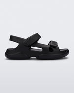 Side view of a black Free Papete sandal