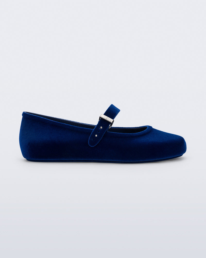 Side view of a blue Soft Ballerina Velvet II flat