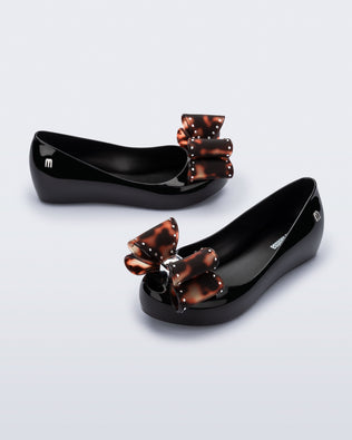 Product element, title Ultragirl Classic Bow in Black/Tortoise
 price $69.00