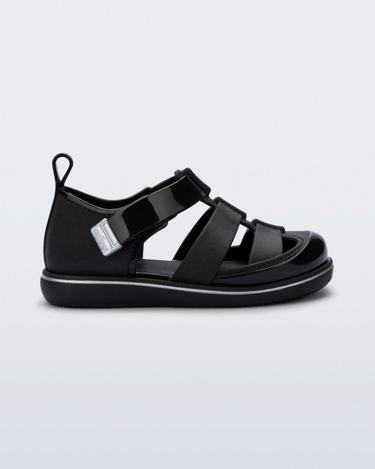 Side view of a black Smash closed toe baby sandal with grey trim