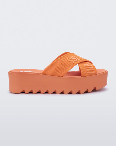 Side view of a beige M Lover Cross Strap platform slide