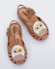 Top view of a pair of beige Possession + Pop Mart Pucky fisherman baby sandals