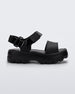 Side view of a Mini Melissa Kick Off platform sandal in black with adjustable velcro ankle strap.