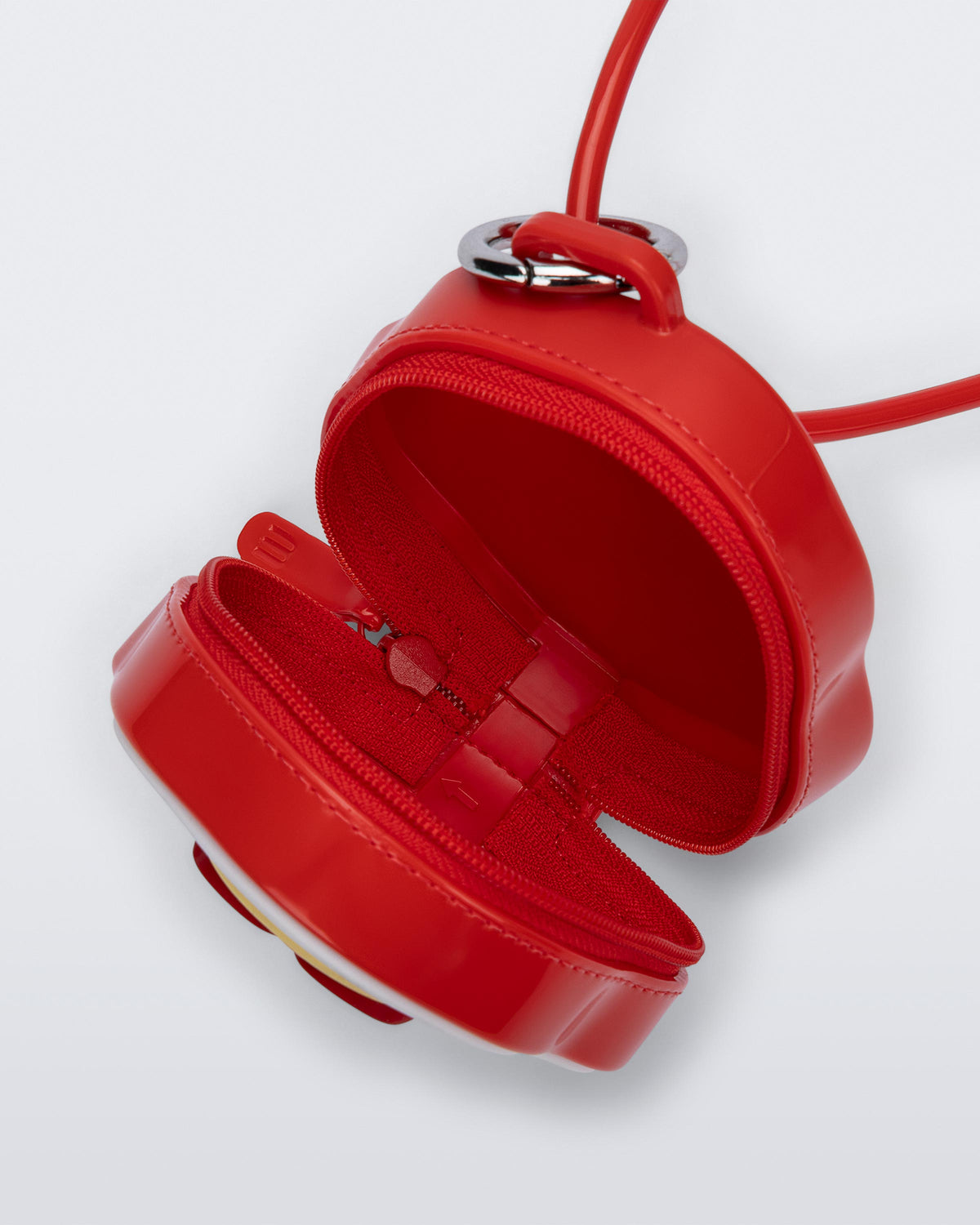 Top view of a red Bag + Pop Mart Pucky small bag with short strap