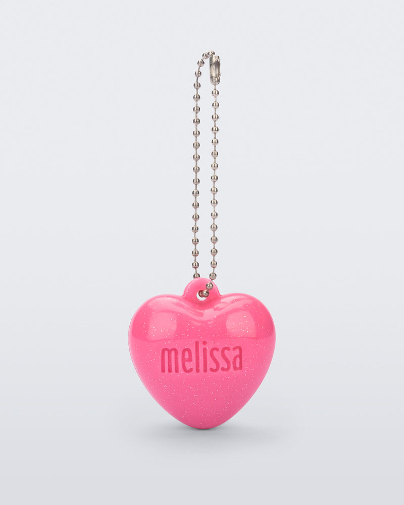 Front view of a pink Heart Charm with the word Melissa engraved