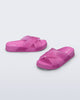 Side and angled view of a pair of pink Cozy M Lover Slides with Melissa on the upper