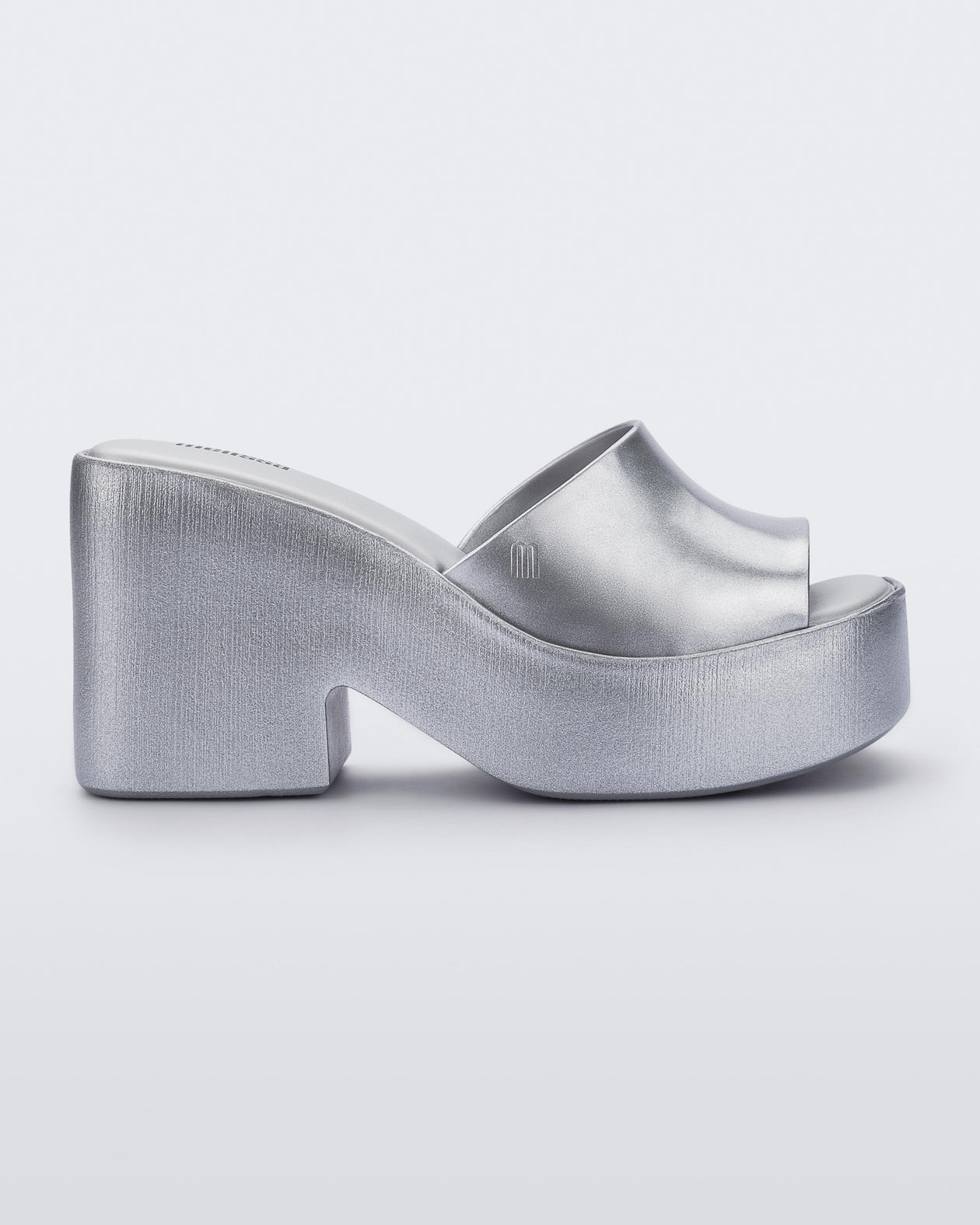 Side view of Melissa Posh platform slide in silver
