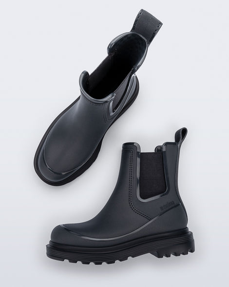 Top and side view of a pair of grey Noir Boots with black soles