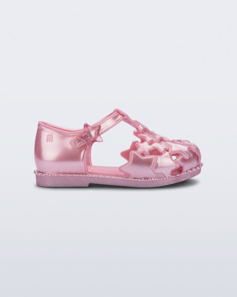 Side view of a pearly pink Starry baby sandal