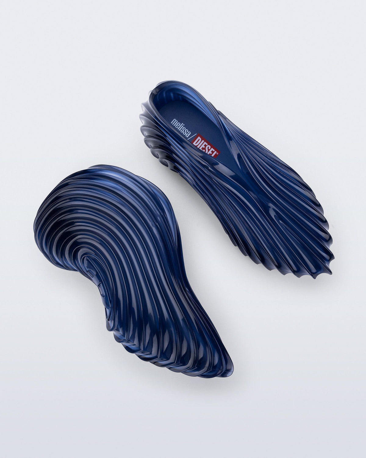 Side and top view of a pair of clear blue Quantum Sneakers