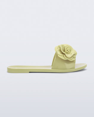 Side view of a green Babe Petals slide sandal