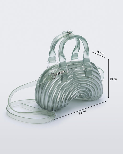 Angled view of a transparent blue Quantum Dome + Diesel bag with hand strap and shoulder strap with dimensions 23 cm x 11 cm x 13 cm