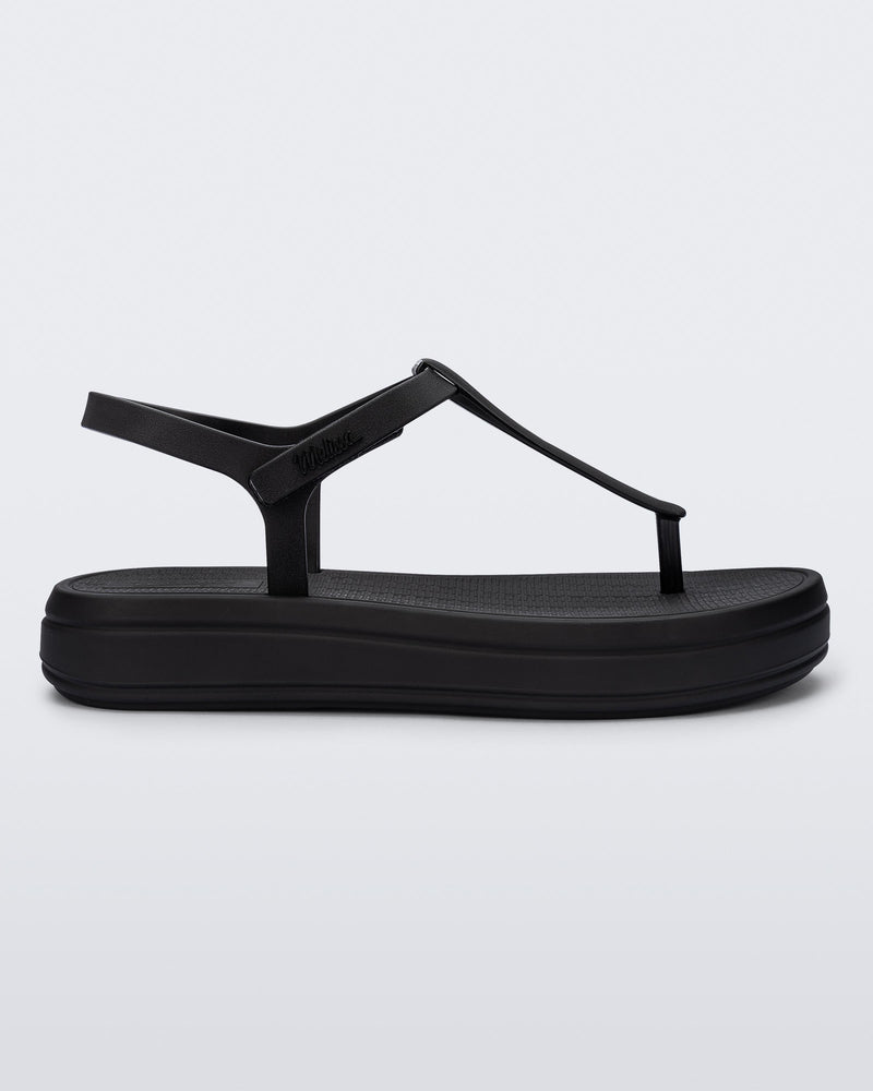 Side view of a black Sun Leme Platform sandal