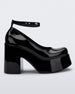 Side view of a black Melissa Doll Heel platform with ankle strap.