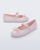 Side and angled view of a pair of pink Soft Ballerina Delicate Bow flats with top strap and bow