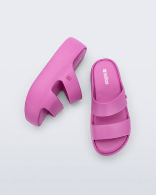 Top and side view of a pair of pink Free Line Platform slides