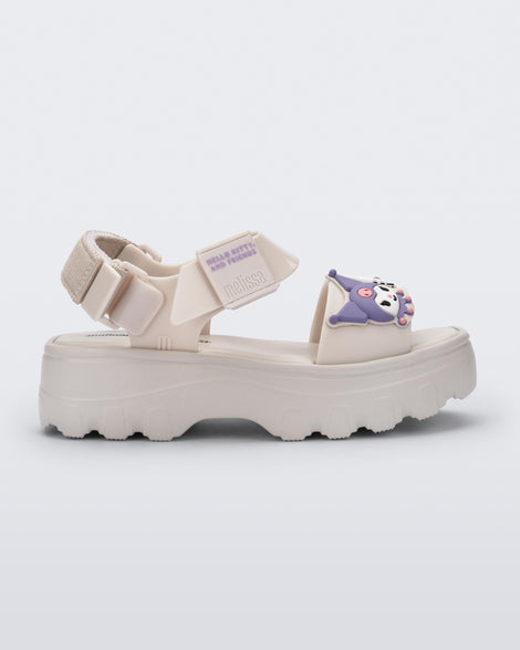 Side view of a beige Kick Off Sandal + Hello Kitty and Friends with Hello Kitty and Friends on the upper strap