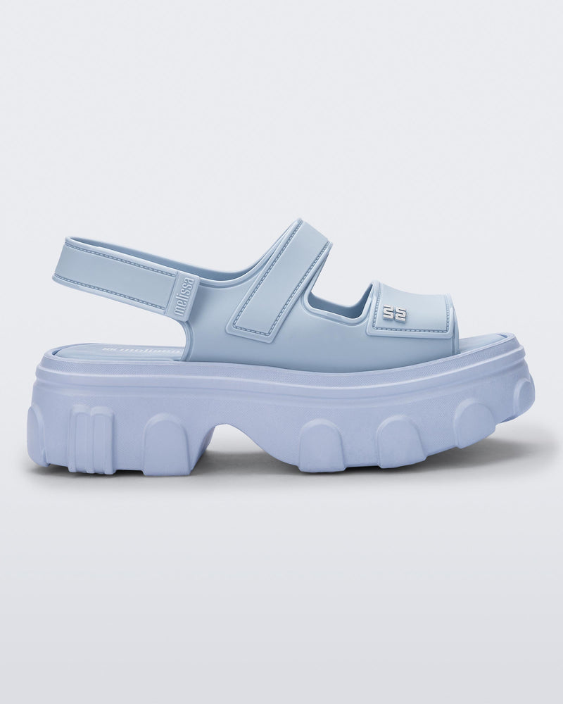 Side view of a blue Ella Move platform sandal.