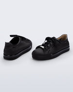 Back and angled view of a pair of black Wow Sneakers with black laces