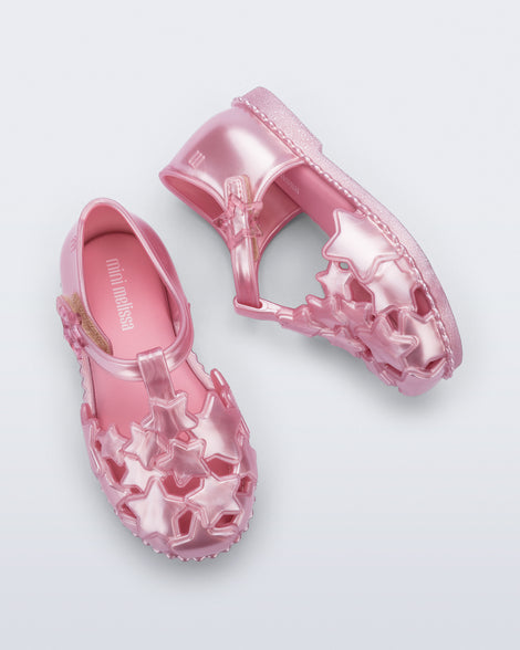 Side and top view of a pair of pearly pink Starry baby sandals