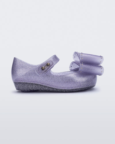 Side view of a glitter lilac Ultragirl Classic bow baby flat