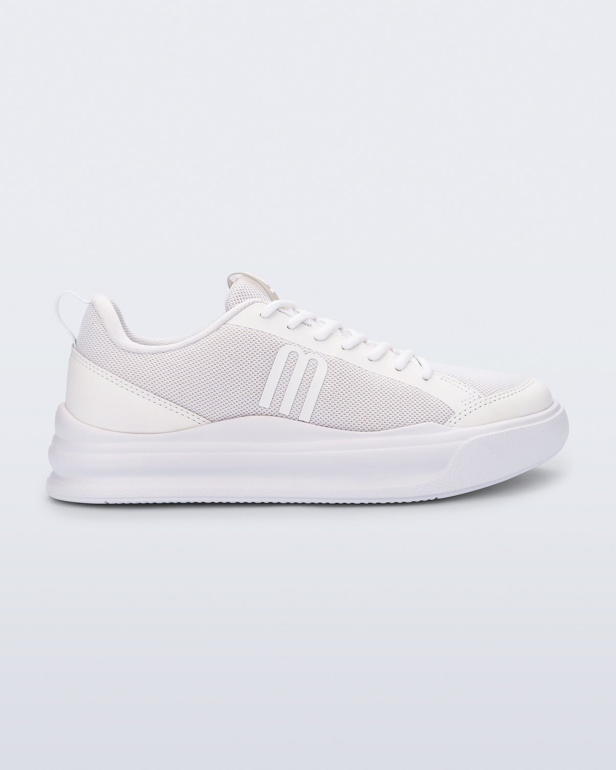 Side view of a white X Mood sneaker