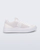 Side view of a white X Mood sneaker