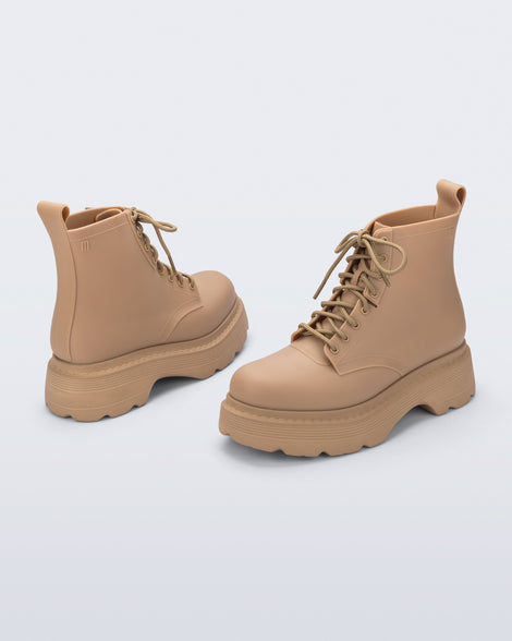 Back and front angled view of a pair of matte beige Coturno Soft Platform boots