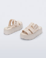 Back and angled view of a pair of beige Pump Platform sandals