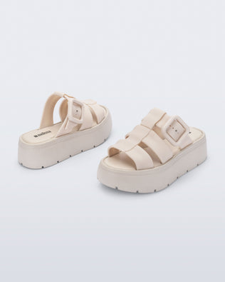 Back and angled view of a pair of beige Pump Platform sandals