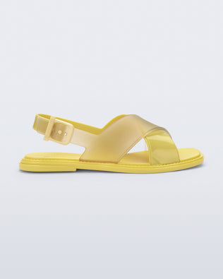 Side view of a yellow Cleo sandal with back strap and crisscross top straps