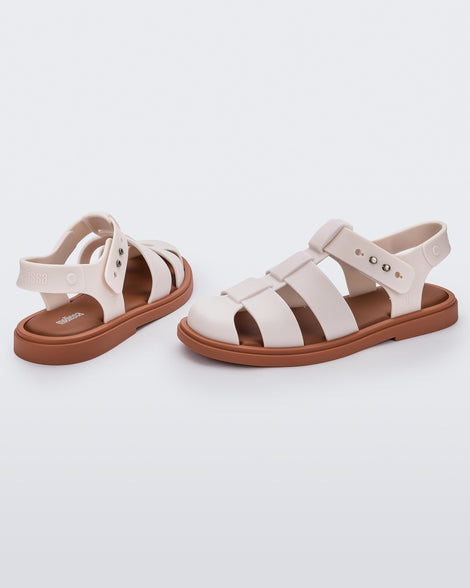 Back and side angled view of a pair of beige Emma women's sandals with brown sole.