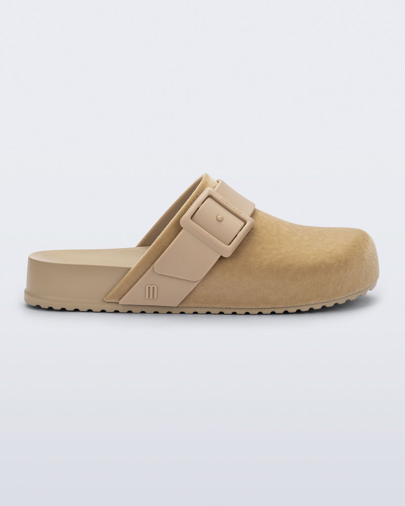 Side view of a beige Cozy Clog Velvet slides