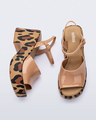 Top and side view of a pair of brown with animal print sole Lina platform heels