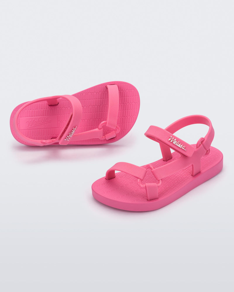 Top and angled view of a pair of pink Sun Downtown baby sandals