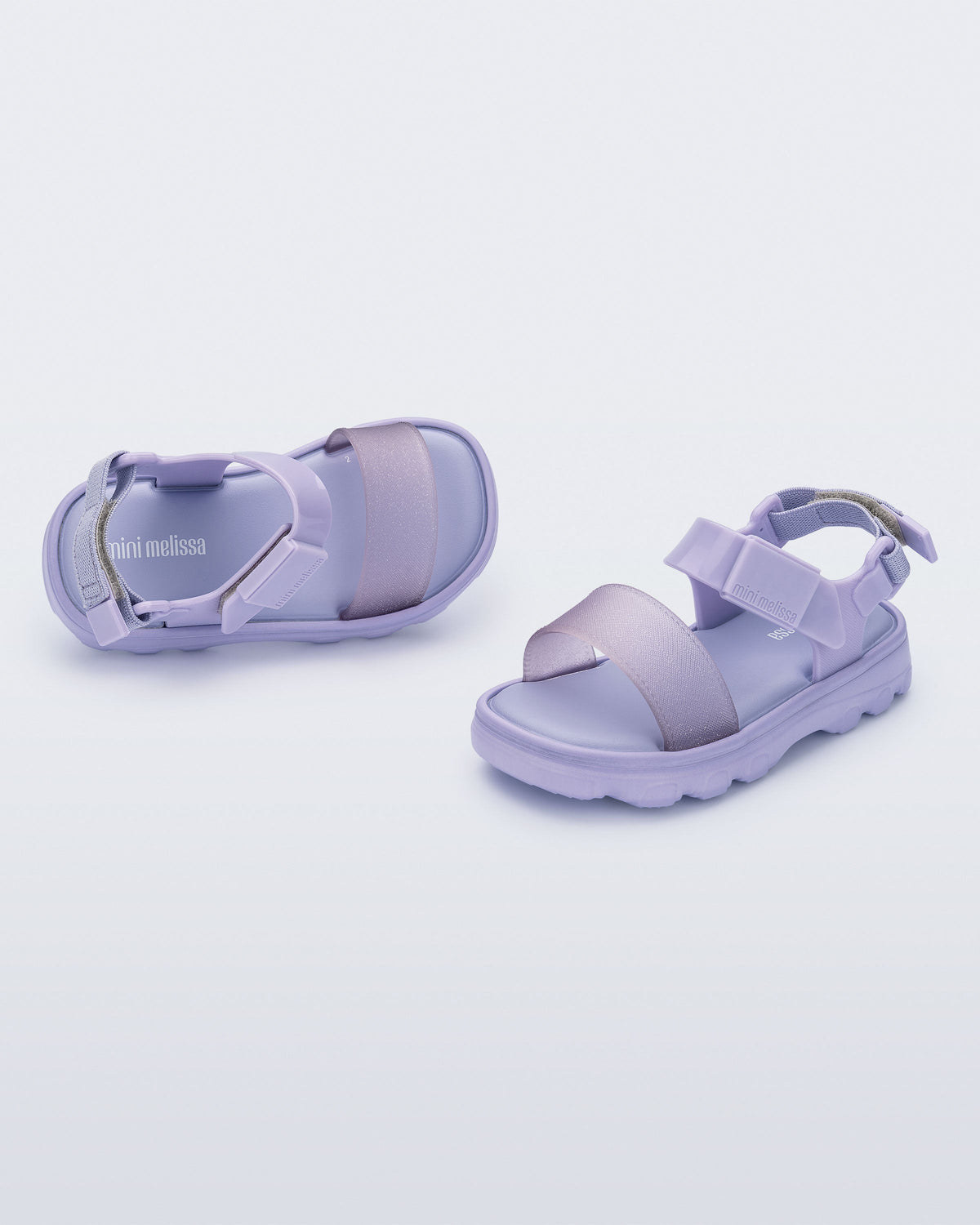 Angled view of a pair of lilac baby Kick Off Sandals