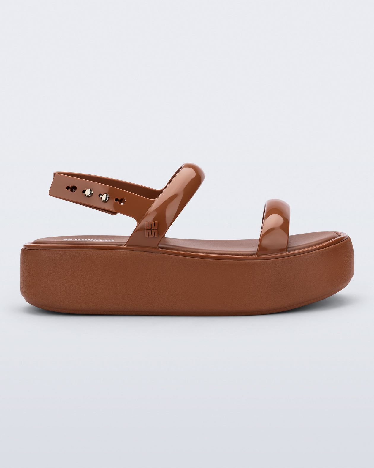 Side view of a brown Wave Platform sandal with top and heel straps