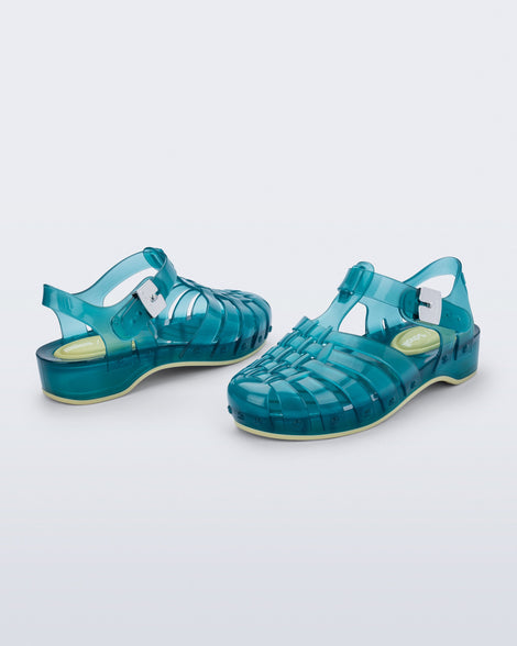 Back and angled view of a pair of blue Possession Pescura + Scholl fisherman sandals