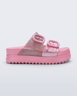 Side view of a pink Cozy Platform kids slide with two straps with buckles, one clear glitter the other pearly pink